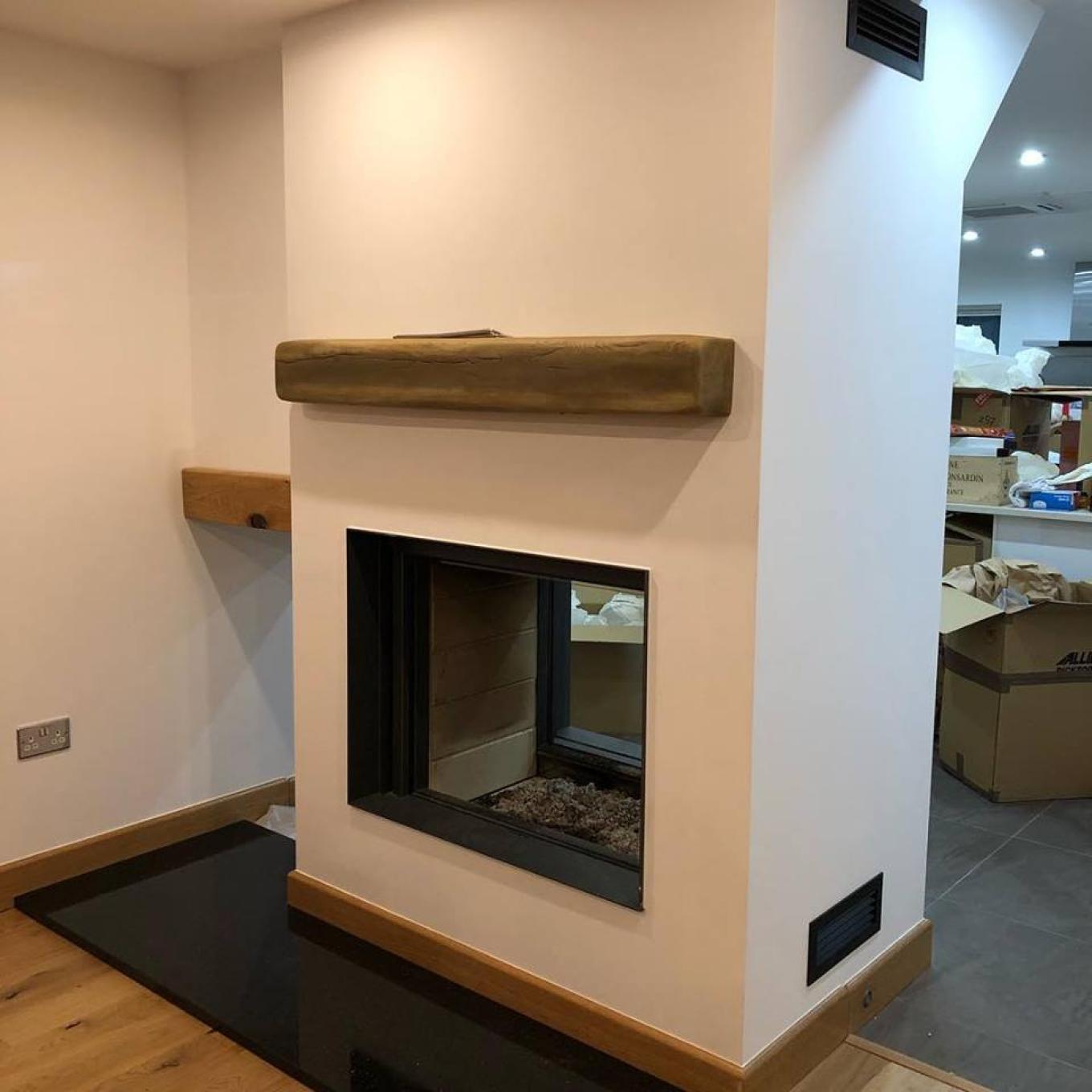 Promafour false chimney breast with stuv stove and geocast beam